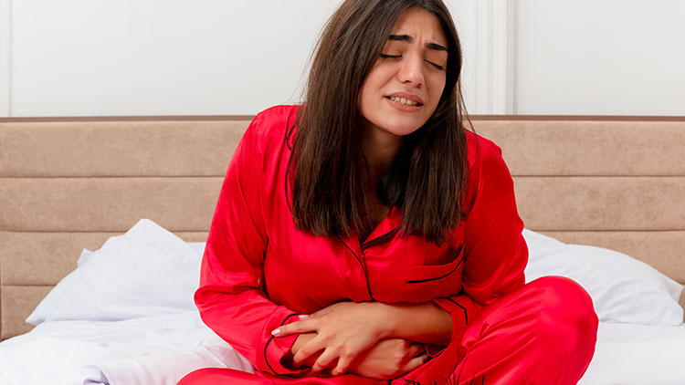 قاعدگی دردناک، علائم و علل